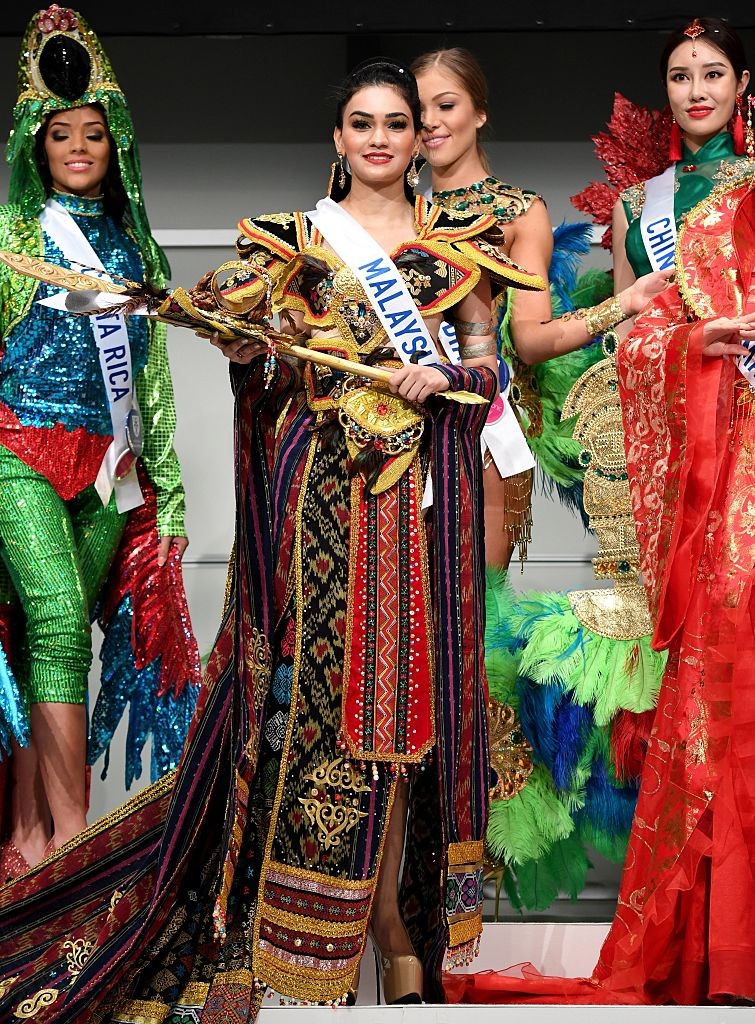 Miss Malaysia Olivia Nicholas (C) poses in her national costume during the opening press preview of 2016 Miss International Beauty Pageant in Tokyo on October 11, 2016.Seventy women will compete in the final in Tokyo on October 27. / AFP / TOSHIFUMI KITAMURA        (Photo credit should read TOSHIFUMI KITAMURA/AFP/Getty Images)